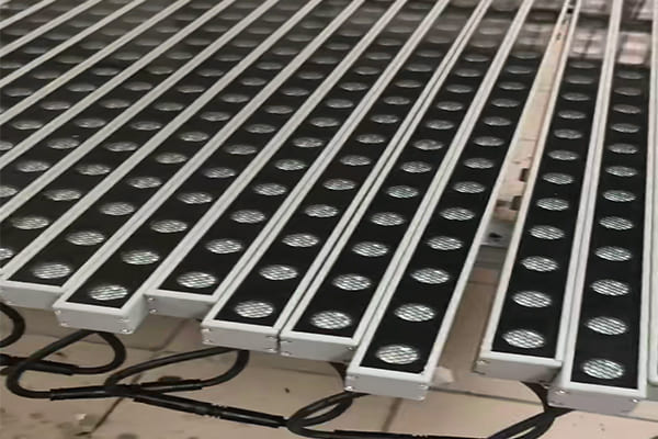 An LED linear light with a honeycomb louver attachment to reduce glare